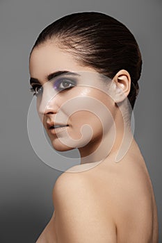 Beautiful model with fashion eyes make-up, clean shiny skin