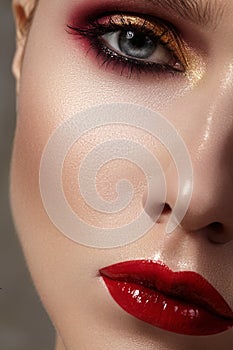 Beautiful model with fashion make-up. Close-up portrait woman with glamour lip gloss makeup