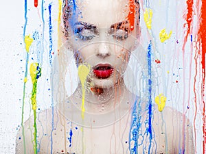 Beautiful model through the glass with bright colors