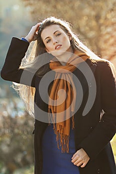 Beautiful model with hand in her long hairs