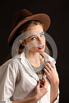 Beautiful model lady in hat in studio