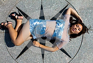 Beautiful model lying on a Mariner Star.