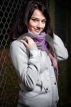 Beautiful model next to fence