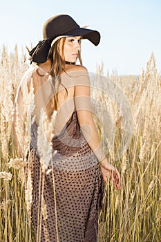 Beautiful model walking in tallgrass