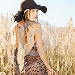 Beautiful model walking in tallgrass - outdoors shot