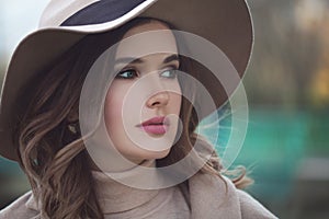 Beautiful Model Woman in Beige Hat Outdoors