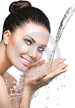 Beautiful model woman with splashes of water