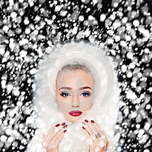 Beautiful Model Woman with Winter Snow. Makeup and Manicure