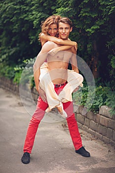 Beautiful modern ballet couple dancing in summer outdoors