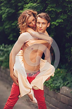 Beautiful modern ballet couple dancing in summer outdoors