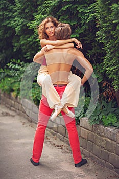 Beautiful modern ballet couple dancing in summer outdoors