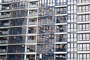 Beautiful modern blue glass fiberglass windows of the facade wall of a modern skyscraper building house. Background, texture