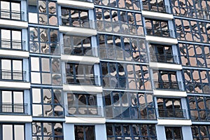 Beautiful modern blue glass fiberglass windows of the facade wall of a modern skyscraper building house. Background, texture