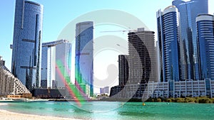 Beautiful modern city surrounded by water | Al Reem island buildings such as Sun and Sky towers in Abu Dhabi city, UAE