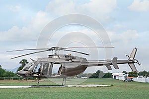 Beautiful modern helicopter on helipad in field