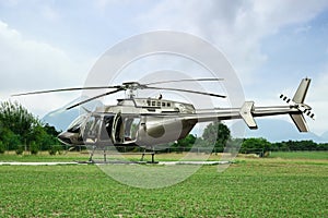Beautiful modern helicopter on helipad in field