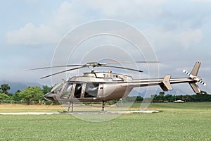 Beautiful modern helicopter on helipad in field