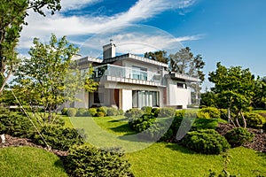 Beautiful modern house in cement, view from the garden.