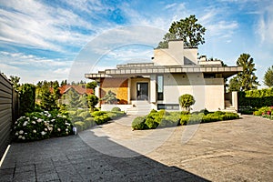 Beautiful modern house in cement, view from the garden