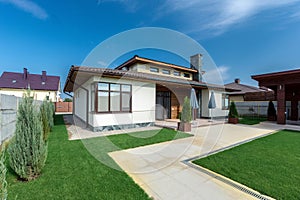 Beautiful modern house in cement, view from the garden