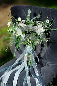 Beautiful modern lush bridal bouquet is standing