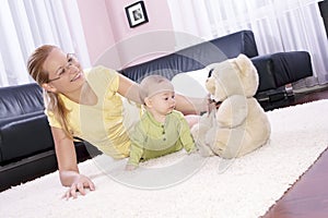 Beautiful mom with her son playing happily.