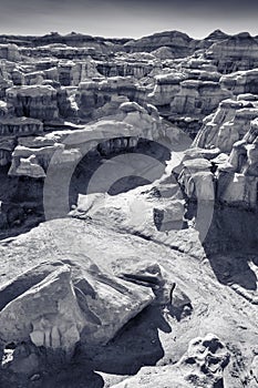 A beautiful monochrome rendering of the cracks, crevices and hills of the Bisti Badlands