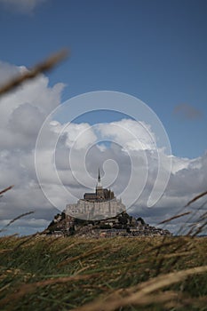 Beautiful Mont Saint Michel cathedral on the island, Normandy, Northern France, Europe. with livestock of sheeps. View at the Mont