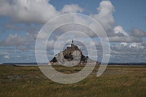 Beautiful Mont Saint Michel cathedral on the island, Normandy, Northern France, Europe. with livestock of sheeps. View at the Mont