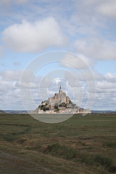 Beautiful Mont Saint Michel cathedral on the island, Normandy, Northern France, Europe. with livestock of sheeps. View at the Mont