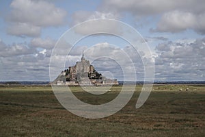 Beautiful Mont Saint Michel cathedral on the island, Normandy, Northern France, Europe. with livestock of sheeps. View at the Mont