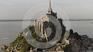 Beautiful Mont Saint Michel cathedral located on the island, Normandy, Northern France, Europe. Action. Panoramic view