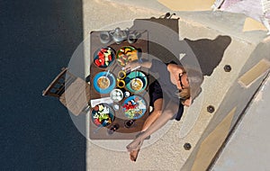 Beautiful morning in Cappadocia - a young girl and traditional Turkish breakfast in Cappadocia