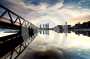 Building reflection on the lake surface, soft and dramatic cloud with colorful on the sky