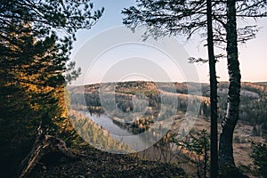 Beautiful morning landscape, first sun rays appears over mountains and river valley, Usva, Ural mountains.