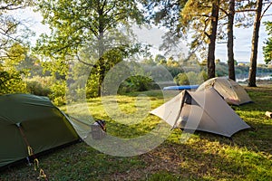 Beautiful morning sun rays illuminate tourist tents