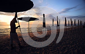 Beautiful morning sunrise with beach parasol