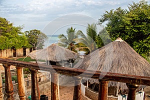 Beautiful morning view on the Indian ocean and the beach from balcony over the hut-tops