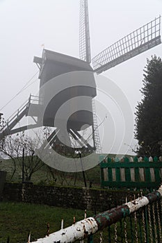 On a beautiful morning whit an old windmill Hertboommolen in the mist