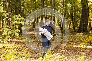 Beautiful Mother And Baby outdoors. Beauty Mum and her Child playing in Park together.