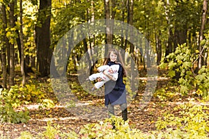 Beautiful Mother And Baby outdoors. Beauty Mum and her Child playing in Park together.