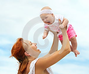 Beautiful Mother And Baby outdoors. Nature. Beauty Mum and her C