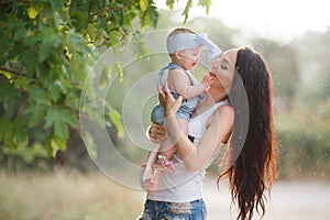 Beautiful mother and baby outdoors in summer Park