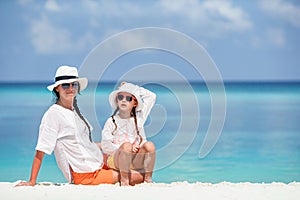 Beautiful mother and daughter on Caribbean beach