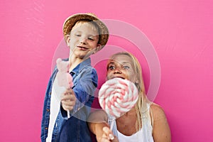 Beautiful mother and son on colored backgrounds