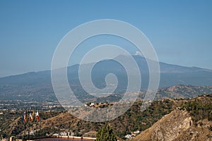 Beautiful Mount Etna and hotel Elios with blue sky in background and photo
