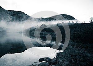 A beautiful mountain lake in a fog in Tatry, Slovakia.