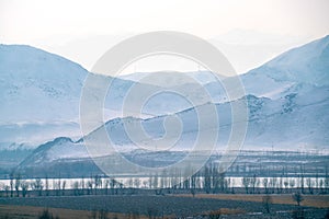 Beautiful mountain and lake scene in the West Tianshan Mountains in winter