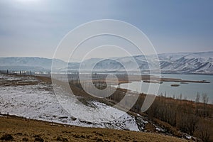 Beautiful mountain and lake scene in the West Tianshan Mountains in winter