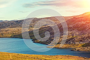 Beautiful mountain lake at sunset. Norway. Nordkapp region, Mageroya island